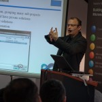 Figure: Juval demonstrating how solutions and projects should fit together (complete with Lady Gaga microphone)